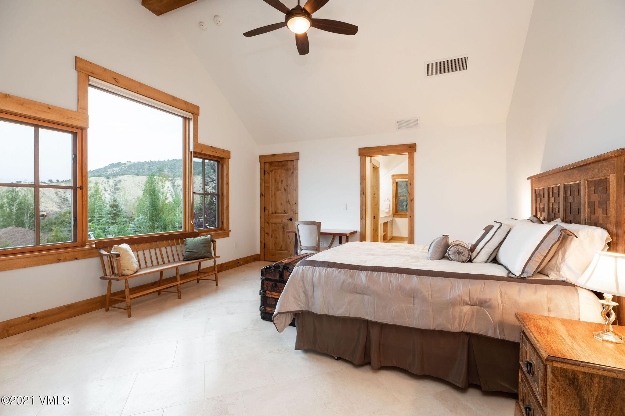 1168 Hernage Creek Road Eagle, CO 81631 - Photo 8 of 22 a bedroom with a bed and a couch next to a window