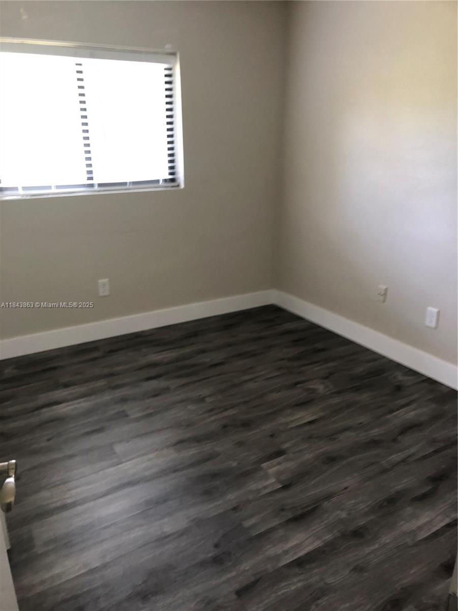 10801 Southwest 123rd Street Miami, FL 33176 - Photo 16 of 25 a view of a small space with wooden floor and a window