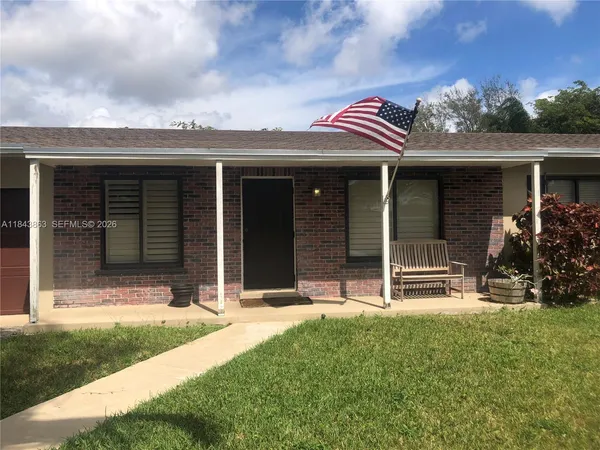 front view of house with a yard