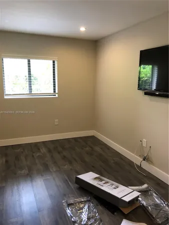 a living room with a couch and a flat screen tv