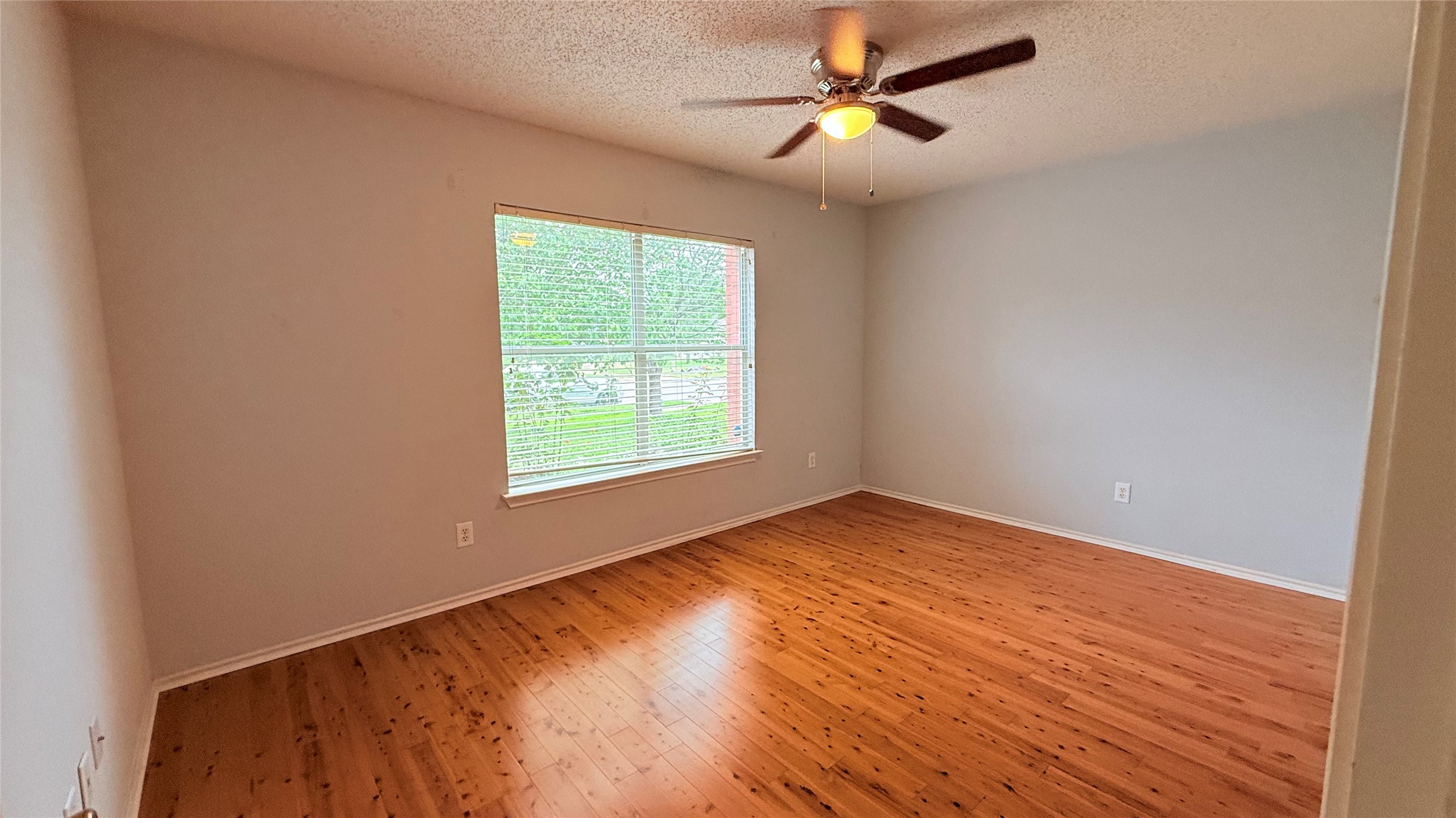 3324 Perch Trail Round Rock, TX 78665 - Photo 20 of 29 a view of empty room with wooden floor and fan