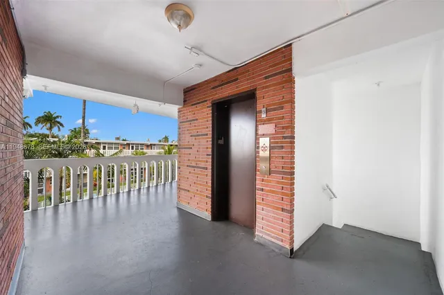 a view of hallway with seating space