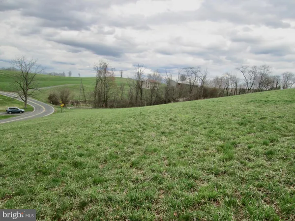 a view of a field with an outdoor space
