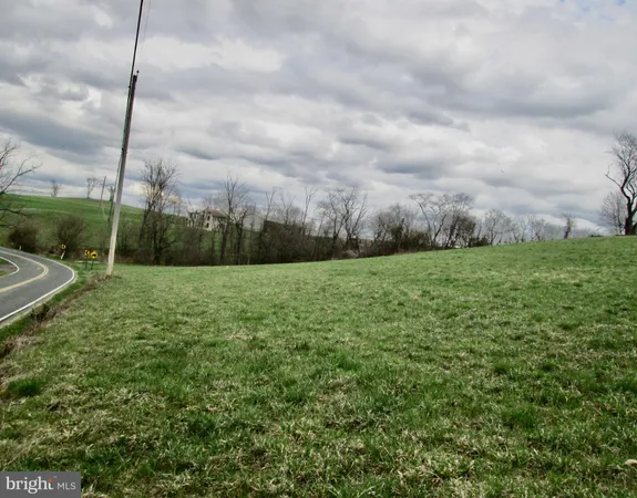 a view of a field with an entryway