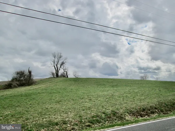 a view of a field with an outdoor space
