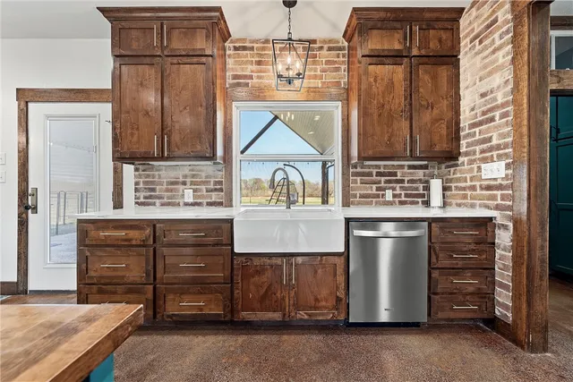 a kitchen with cabinets and window