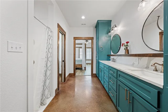 a bathroom with a double vanity sink and a mirror