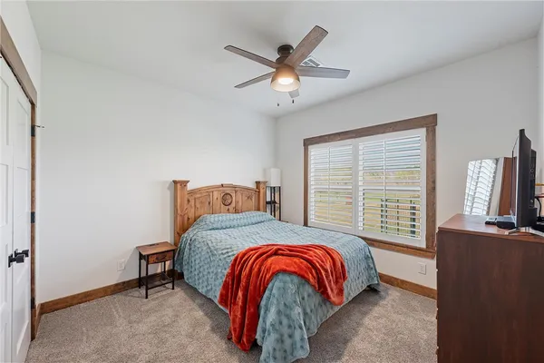a bedroom with a bed and window