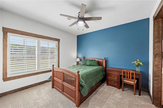 a bedroom with a bed and a table