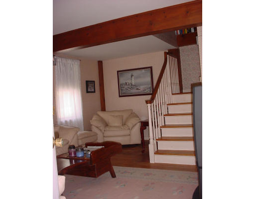 8 Arnold Road Sturbridge, MA 01518 - Photo 3 of 5 a living room with furniture and stairs