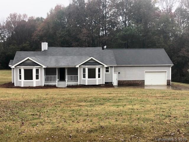 5512 Griffith Road Monroe, NC 28112 - Photo 1 of 36 a front view of a house with a yard