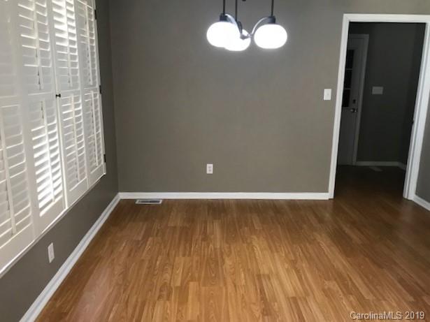 5512 Griffith Road Monroe, NC 28112 - Photo 18 of 36 a view of room with window and wooden floor