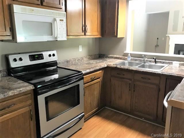 5512 Griffith Road Monroe, NC 28112 - Photo 20 of 36 a kitchen with a stove microwave and sink