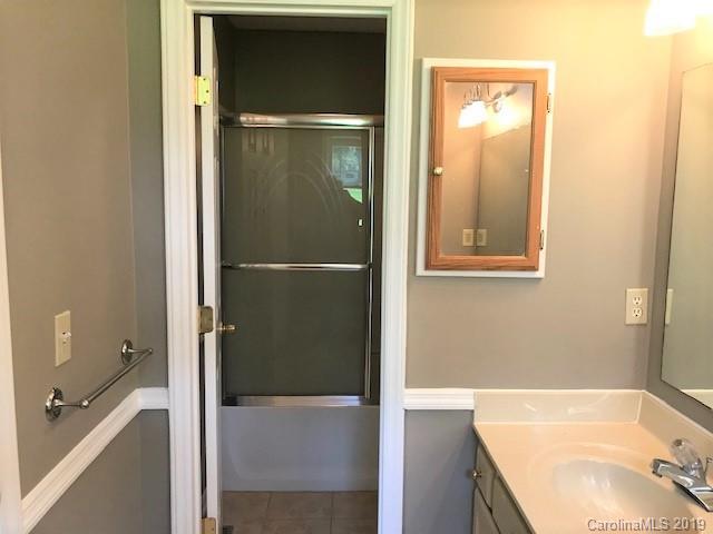 5512 Griffith Road Monroe, NC 28112 - Photo 26 of 36 a bathroom with a tub and a sink