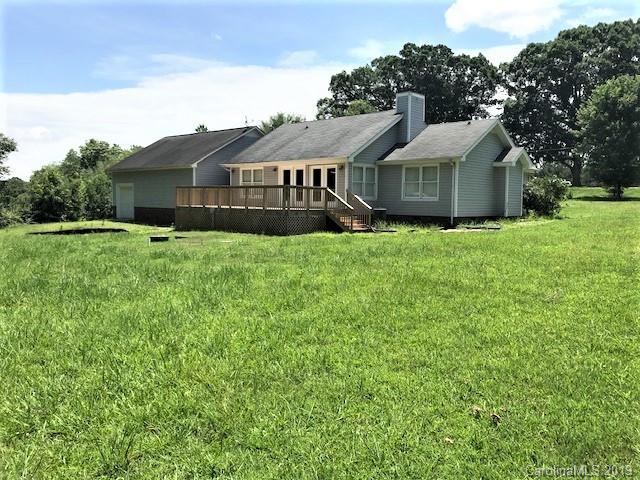 5512 Griffith Road Monroe, NC 28112 - Photo 4 of 36 a view of house with backyard and garden