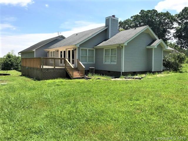 5512 Griffith Road Monroe, NC 28112 - Photo 5 of 36 a front view of a house with a yard and fence