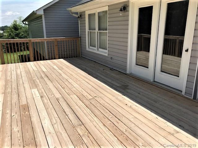 5512 Griffith Road Monroe, NC 28112 - Photo 6 of 36 a balcony with view of wooden floor