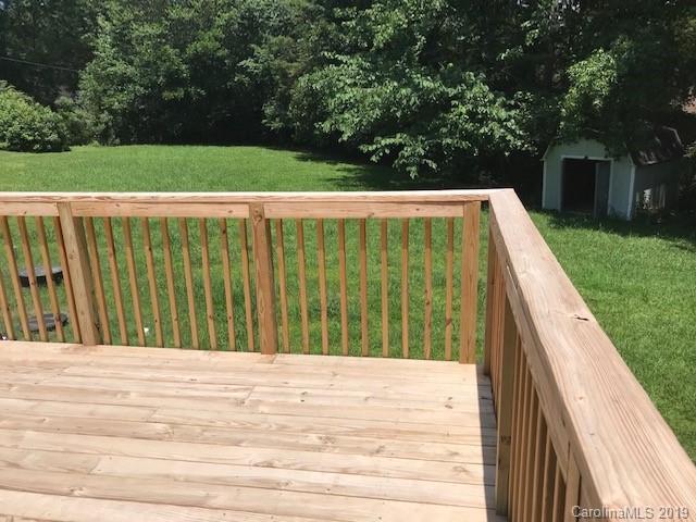 5512 Griffith Road Monroe, NC 28112 - Photo 8 of 36 a view of outdoor space with swimming pool and trees in the background
