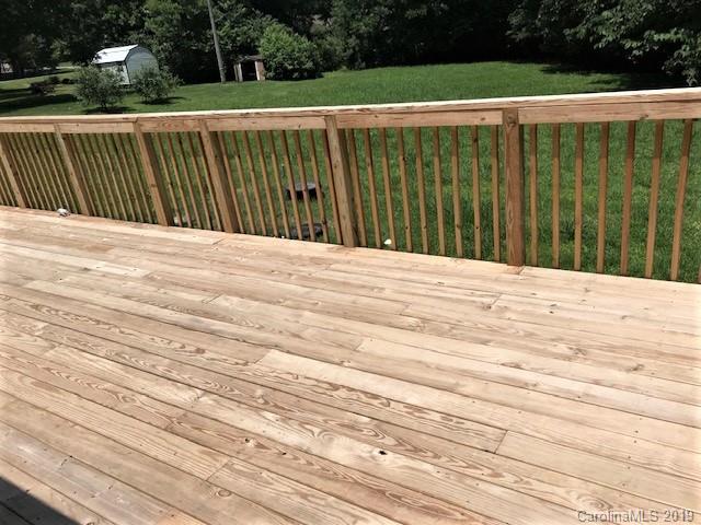 5512 Griffith Road Monroe, NC 28112 - Photo 9 of 36 a view of a wooden deck