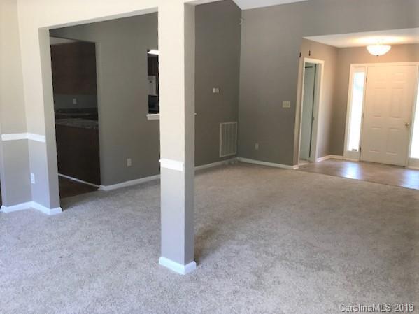 5512 Griffith Road Monroe, NC 28112 - Photo 10 of 36 an empty room with windows