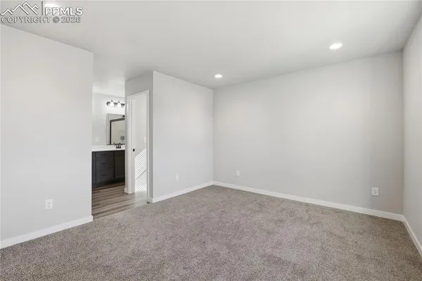 a bathroom with a double vanity sink and mirror