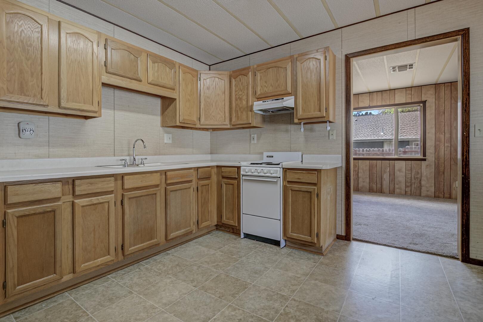411 West Bridle Path Lane Payson, AZ 85541 - Photo 13 of 21 a kitchen with stainless steel appliances granite countertop a stove a sink and a microwave