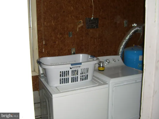 a view of livingroom with furniture and a fireplace