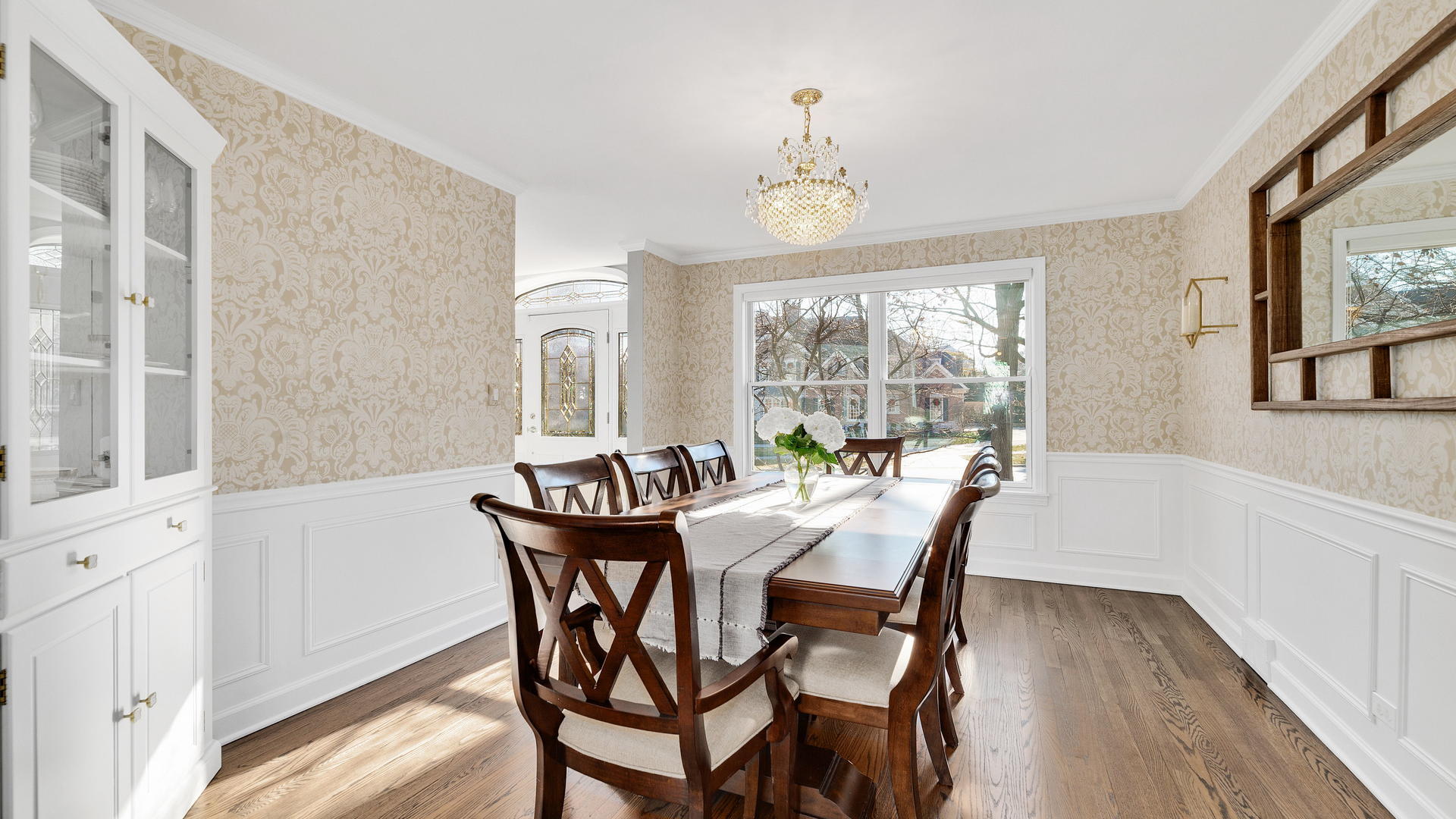 105 Ravine Road Hinsdale, IL 60521 - Photo 3 of 35 a view of a dining room with furniture a chandelier and wooden floor