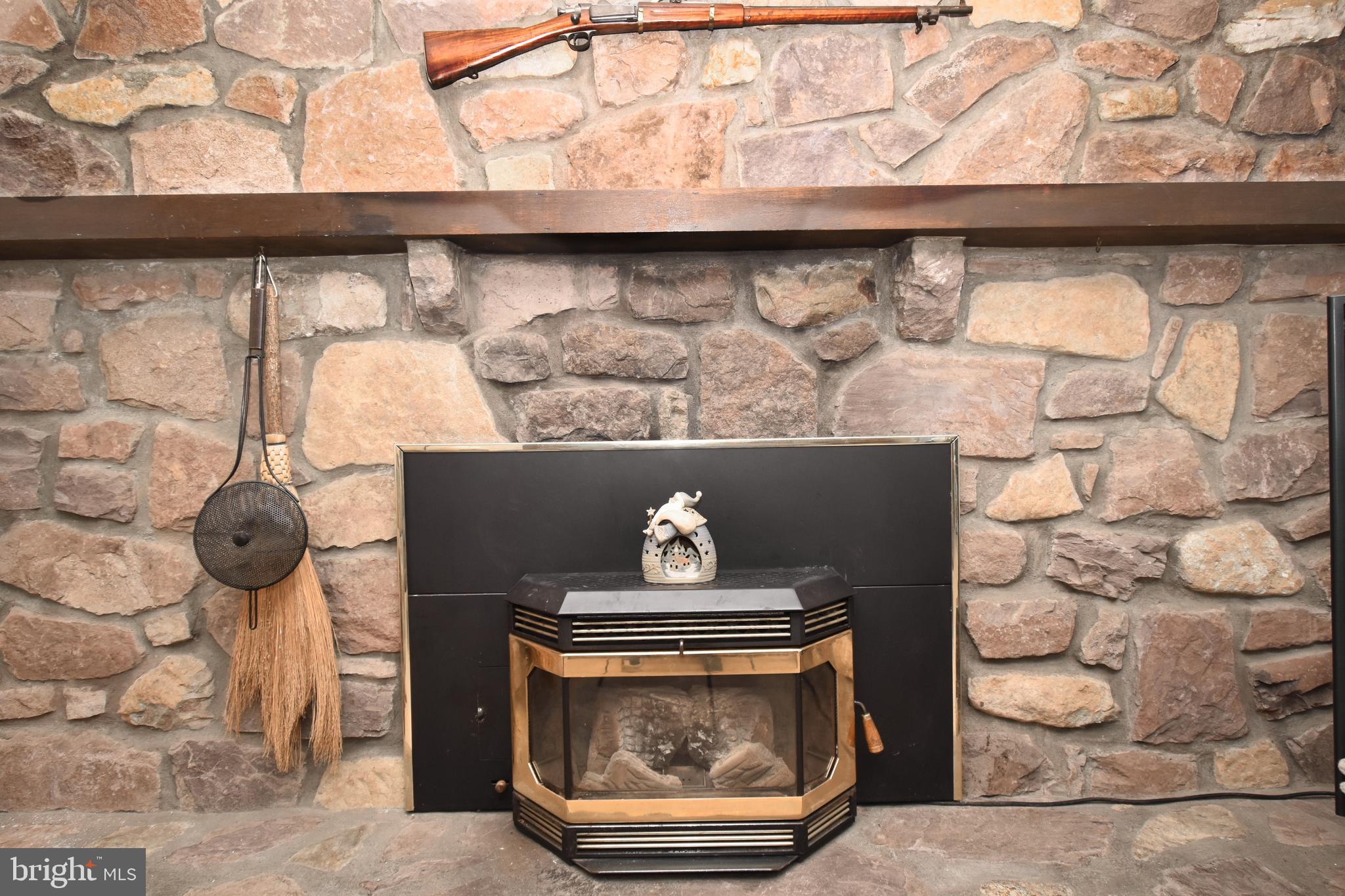 4958 Edgewood Road Doylestown, PA 18902 - Photo 17 of 47 Stone Wall Fireplace in F/R with Pellet Stove
