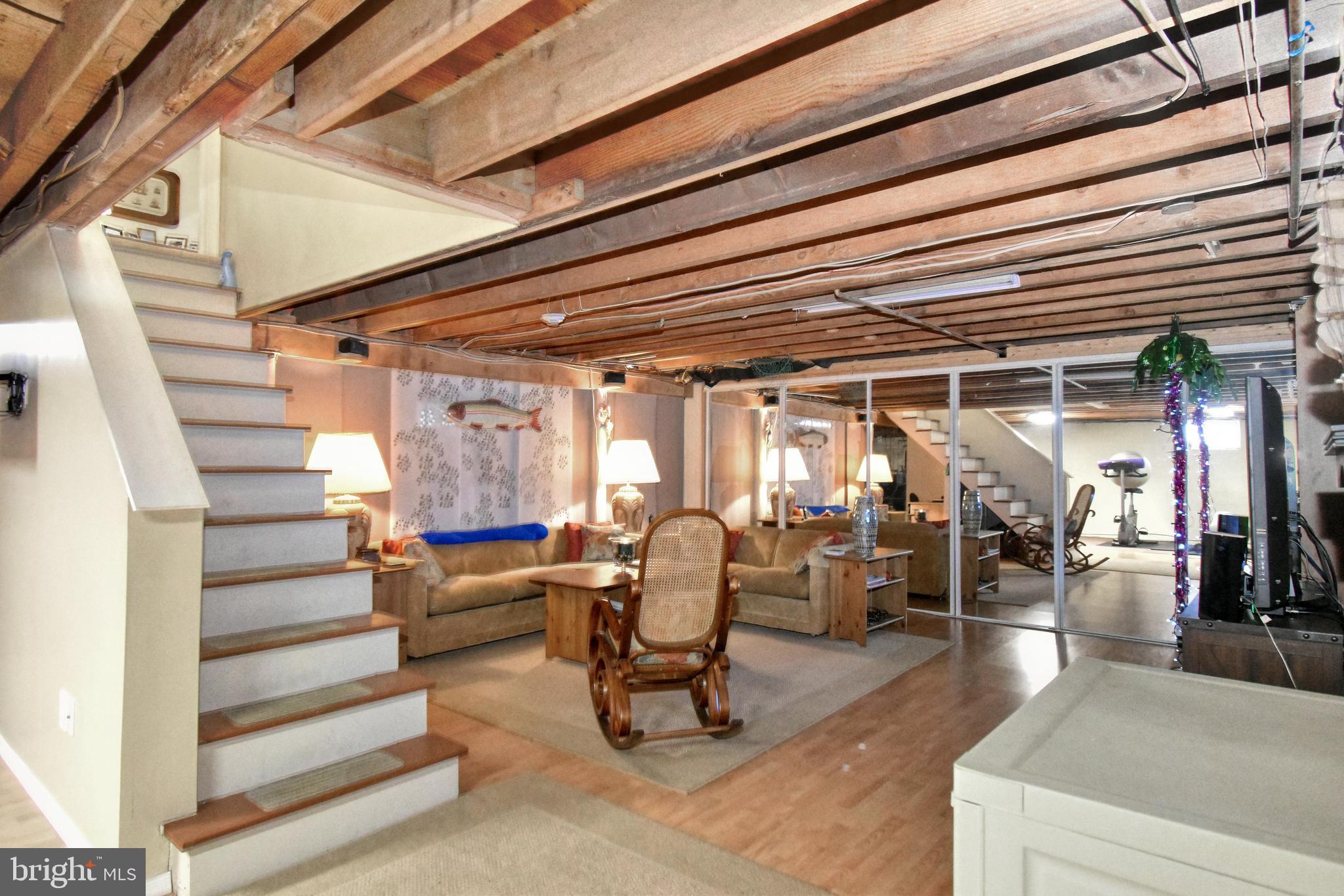 4958 Edgewood Road Doylestown, PA 18902 - Photo 36 of 47 Partial finished basement with faux wood flooring