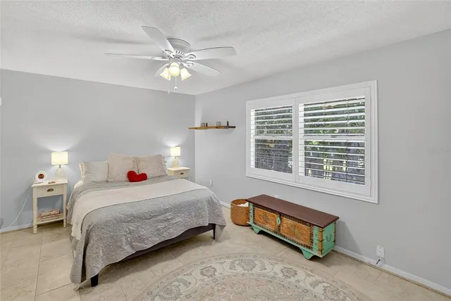 a bedroom with a bed and cabinets
