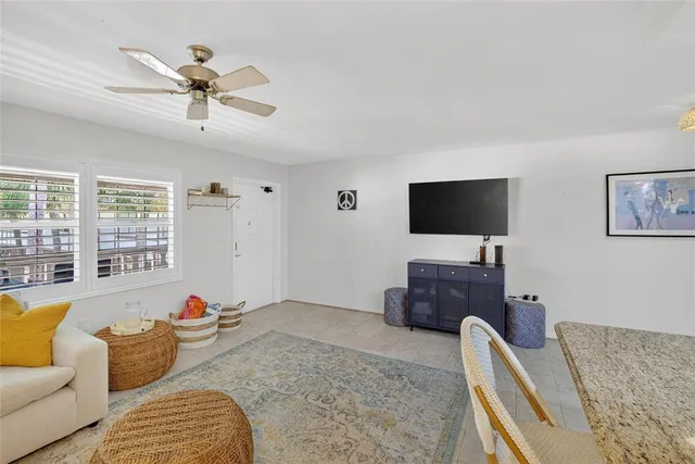 a room with furniture and view of living room