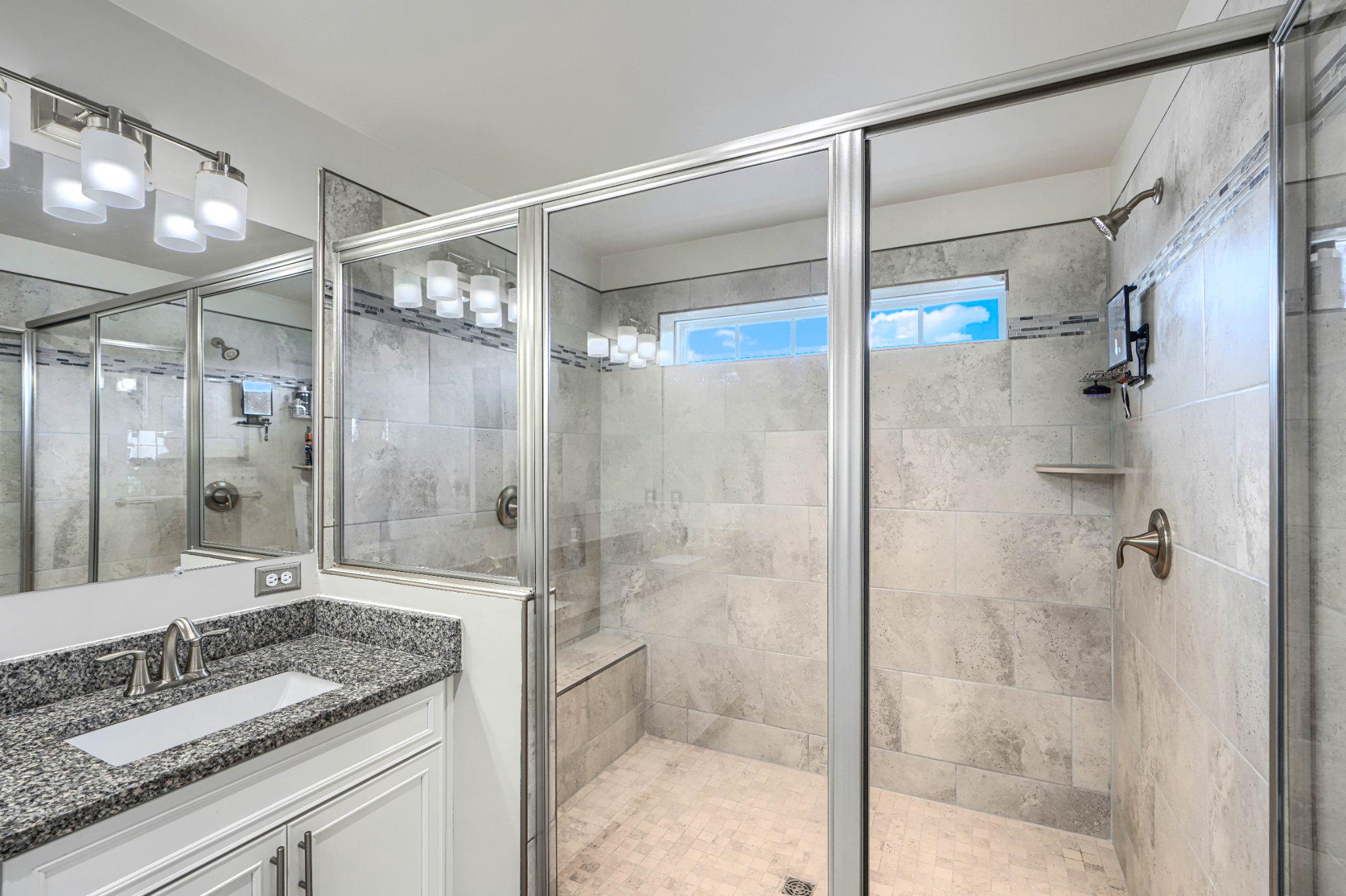 2707 Lady Slipper Road Gambrills, MD 21054 - Photo 39 of 60 a bathroom with a granite countertop shower mirror and a sink