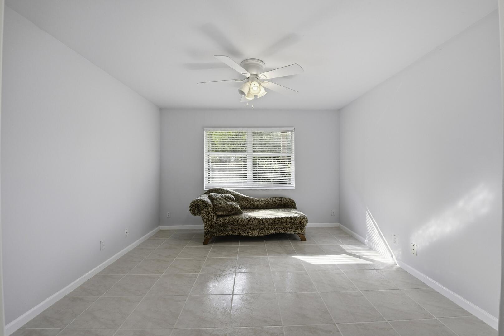 7617 Island Breeze Terrace Boynton Beach, FL 33437 - Photo 17 of 46 a living room with furniture and a window