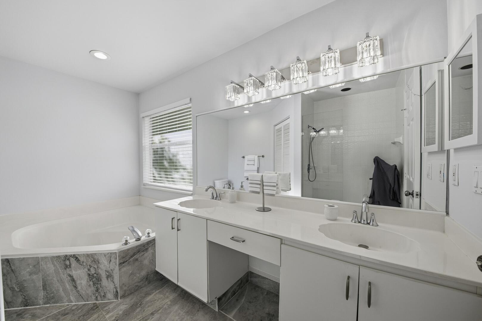 7617 Island Breeze Terrace Boynton Beach, FL 33437 - Photo 41 of 46 a bathroom with a bathtub a sink and mirror