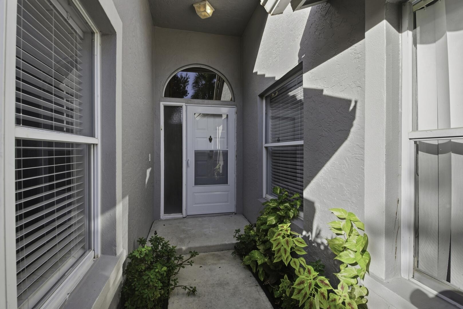 7617 Island Breeze Terrace Boynton Beach, FL 33437 - Photo 46 of 46 a front view of a house with a yard