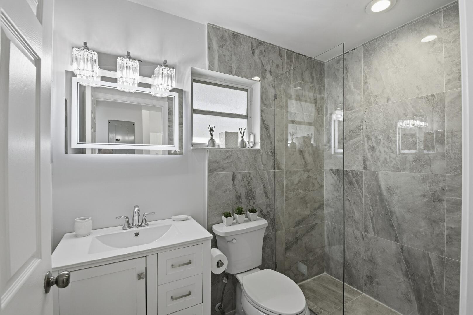 7617 Island Breeze Terrace Boynton Beach, FL 33437 - Photo 6 of 46 a bathroom with a sink toilet and shower