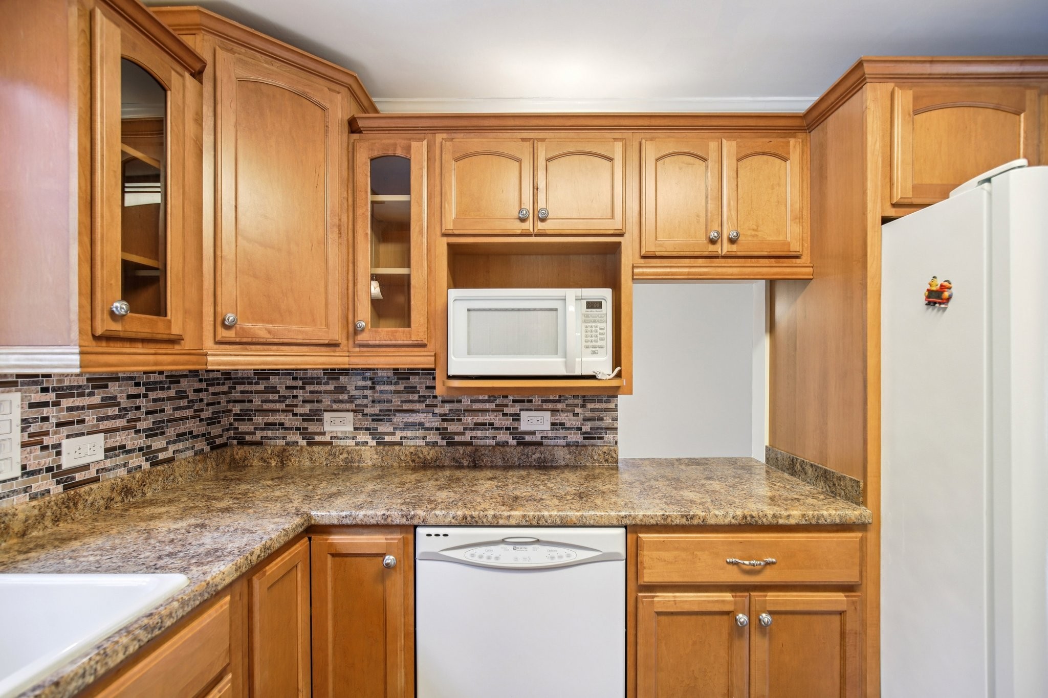 2411 Cloverdale Road Nashville, TN 37214 - Photo 11 of 33 a kitchen with granite countertop a sink and a refrigerator