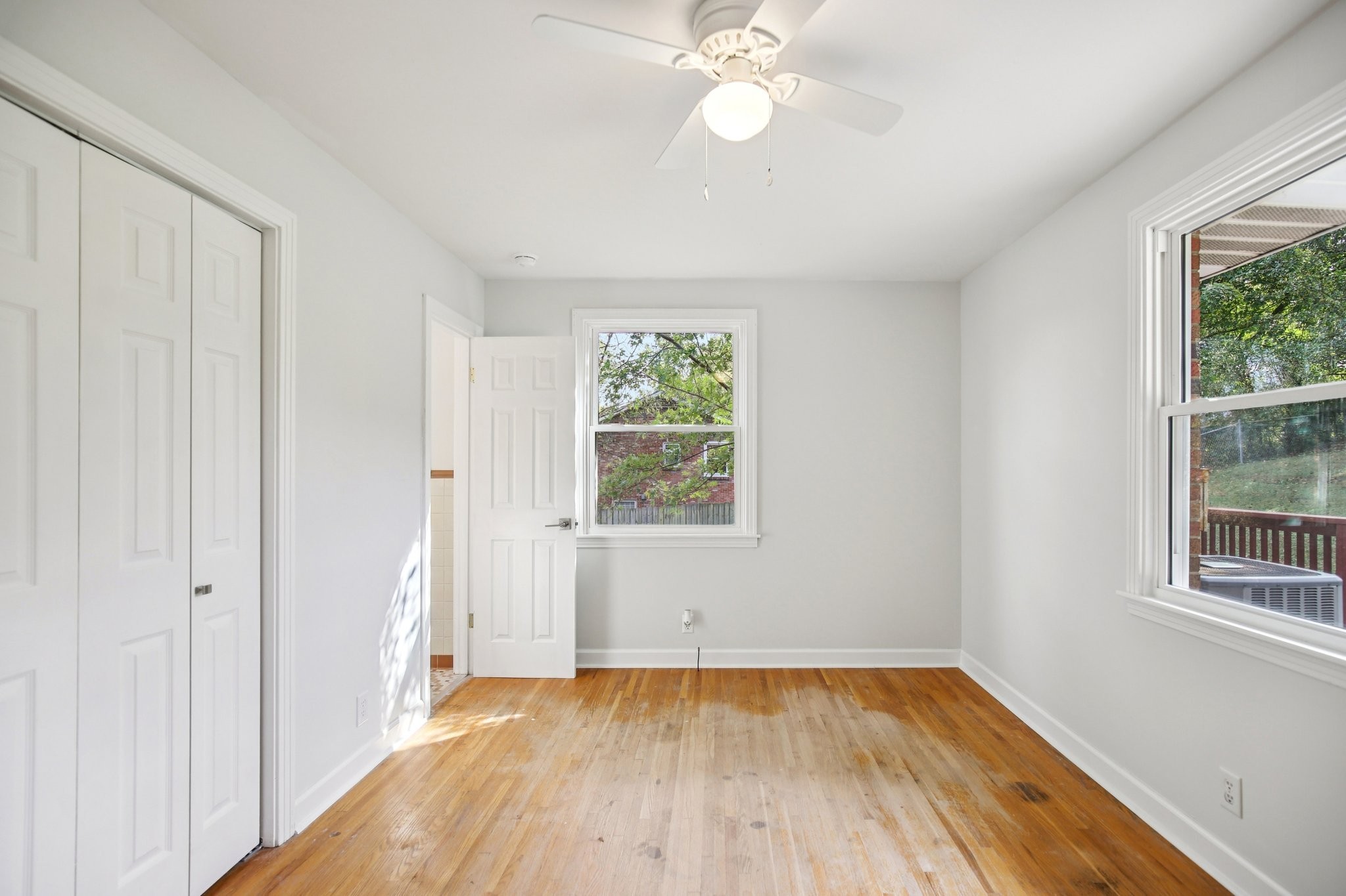 2411 Cloverdale Road Nashville, TN 37214 - Photo 19 of 33 a view of an empty room with wooden floor and window