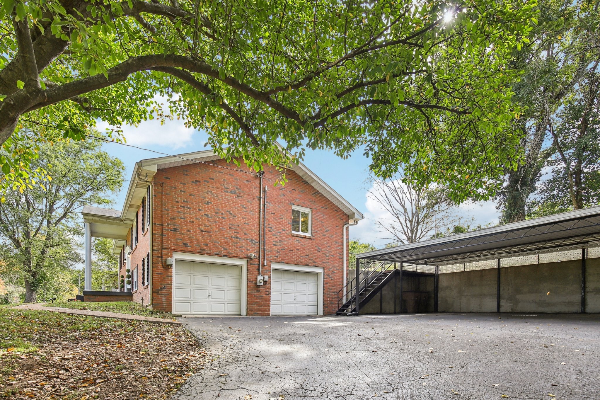 2411 Cloverdale Road Nashville, TN 37214 - Photo 30 of 33 a front view of a house with a yard and garage