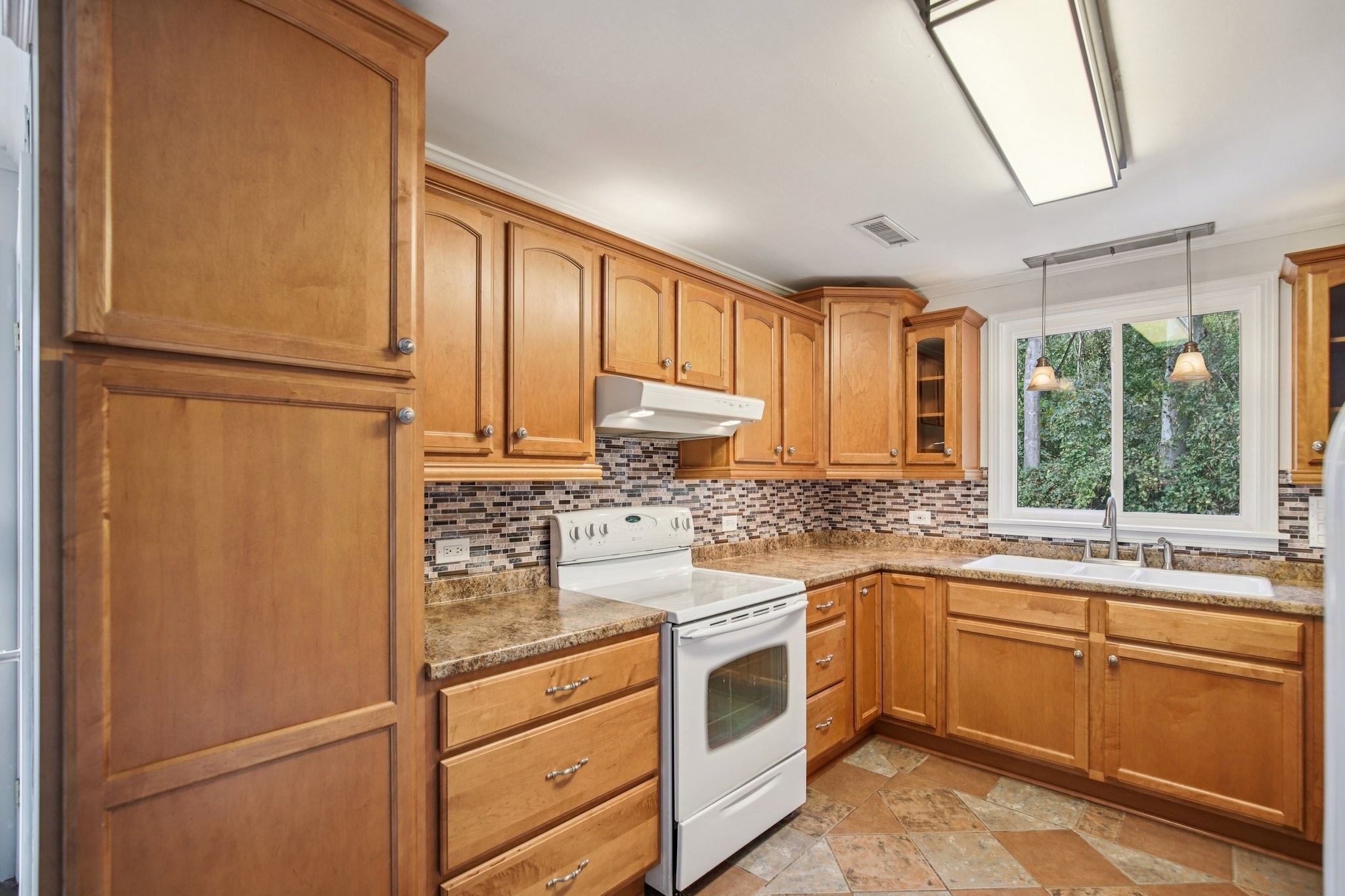 2411 Cloverdale Road Nashville, TN 37214 - Photo 10 of 33 a kitchen with stainless steel appliances granite countertop cabinets and a refrigerator