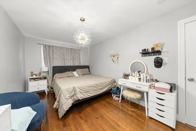 a bedroom with a bed and cabinets