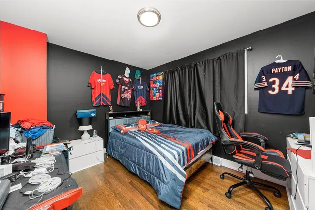 a bed room with furniture and a flat screen tv