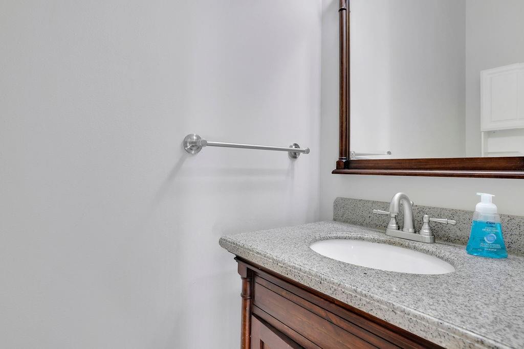 4085 Spring Cove Drive Duluth, GA 30097 - Photo 17 of 45 a bathroom with a granite countertop sink and a mirror