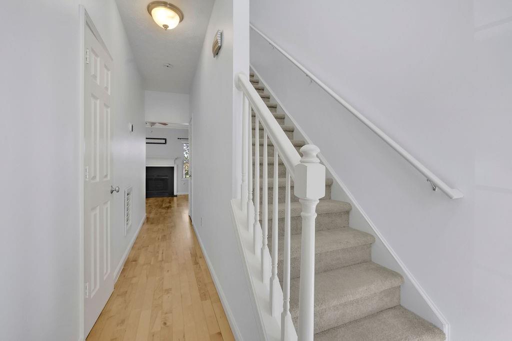 4085 Spring Cove Drive Duluth, GA 30097 - Photo 19 of 45 a view of a hallway with wooden floor and entryway