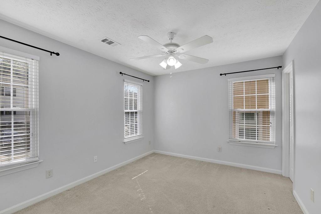 4085 Spring Cove Drive Duluth, GA 30097 - Photo 27 of 45 a view of an empty room with a window
