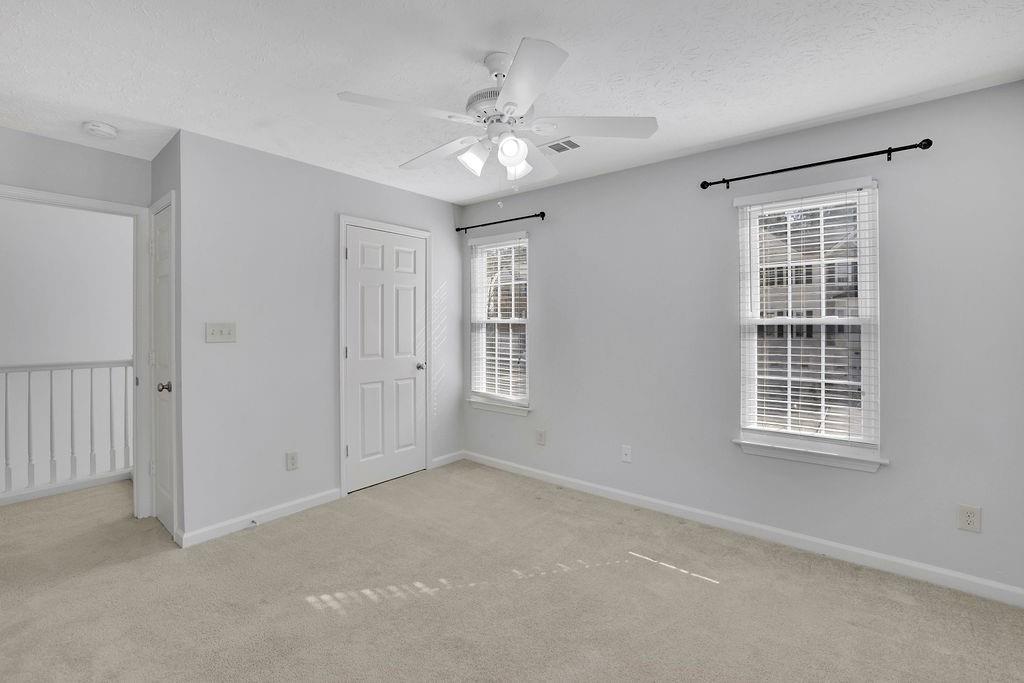 4085 Spring Cove Drive Duluth, GA 30097 - Photo 29 of 45 a view of an empty room with a window