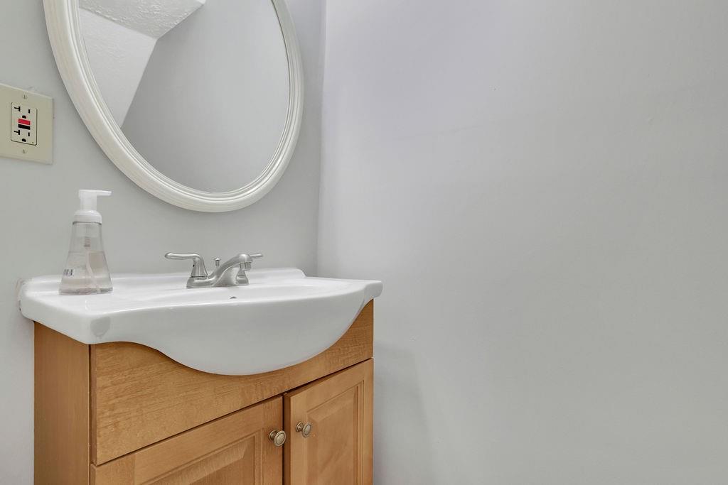 4085 Spring Cove Drive Duluth, GA 30097 - Photo 39 of 45 a bathroom with a sink and a mirror