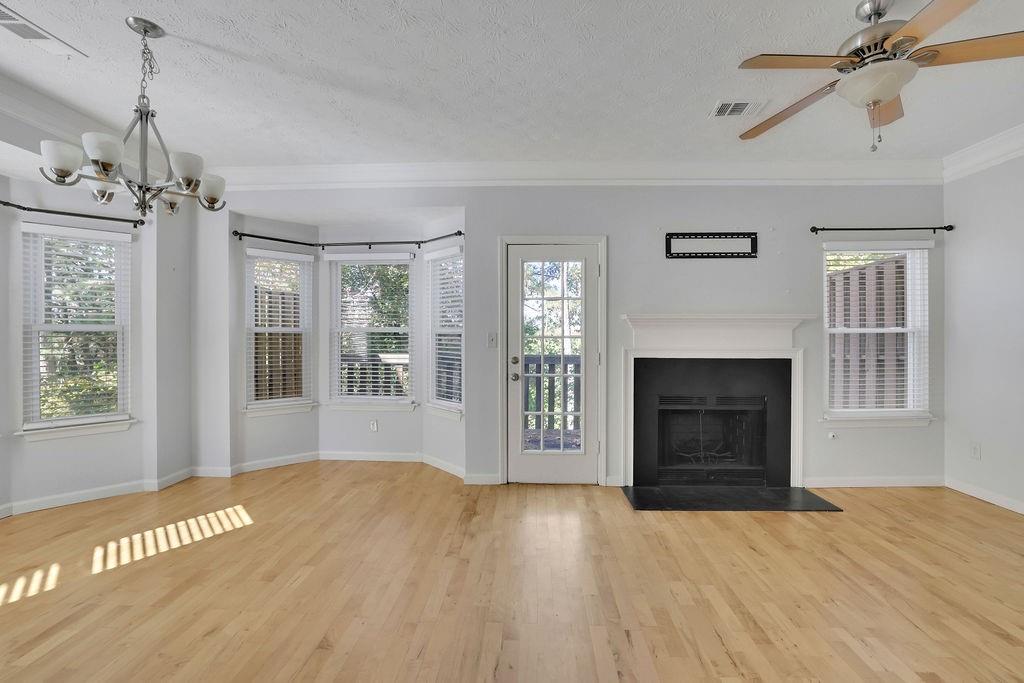 4085 Spring Cove Drive Duluth, GA 30097 - Photo 8 of 45 a view of a livingroom with a fireplace and window