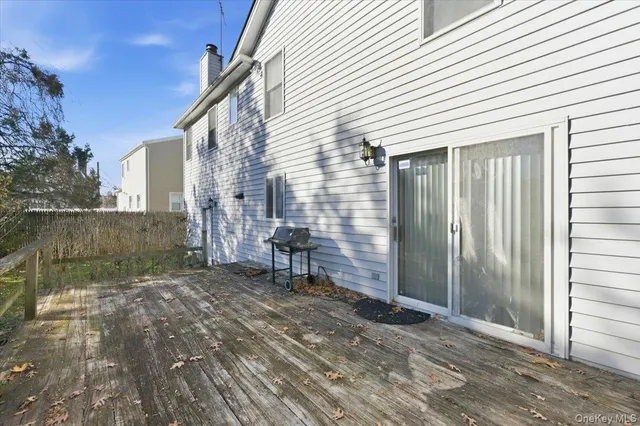 a view of a house with a yard and potted plants